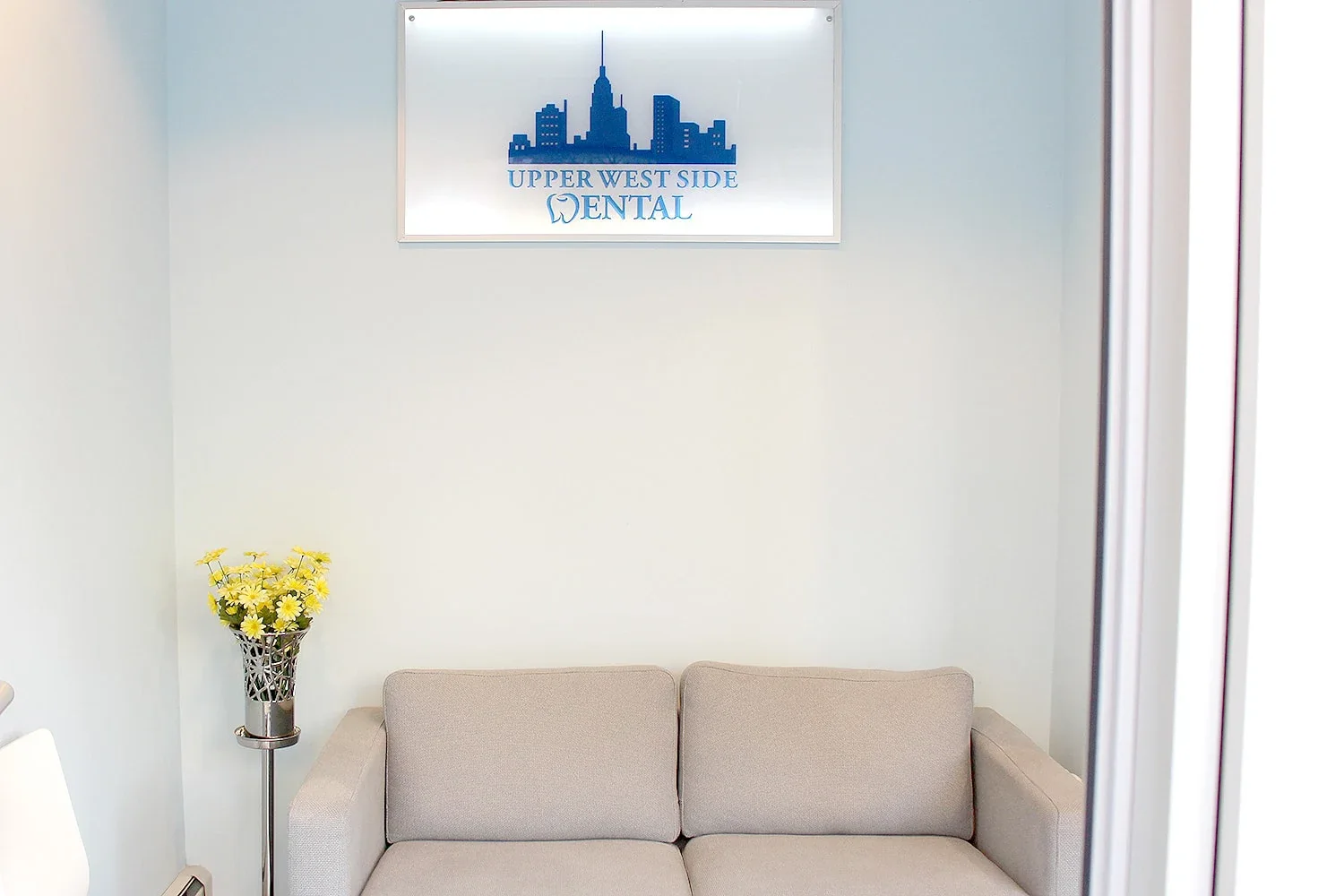 A quiet waiting-room couch at Upper West Side Dental